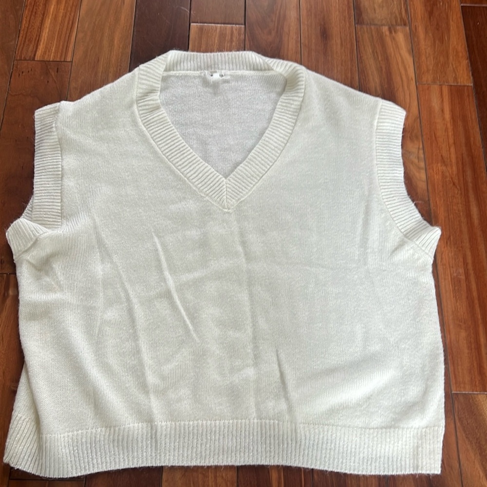 Like new size medium sweater vest in a cream color from Mimosa